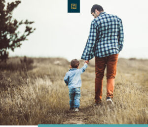 father with child in field