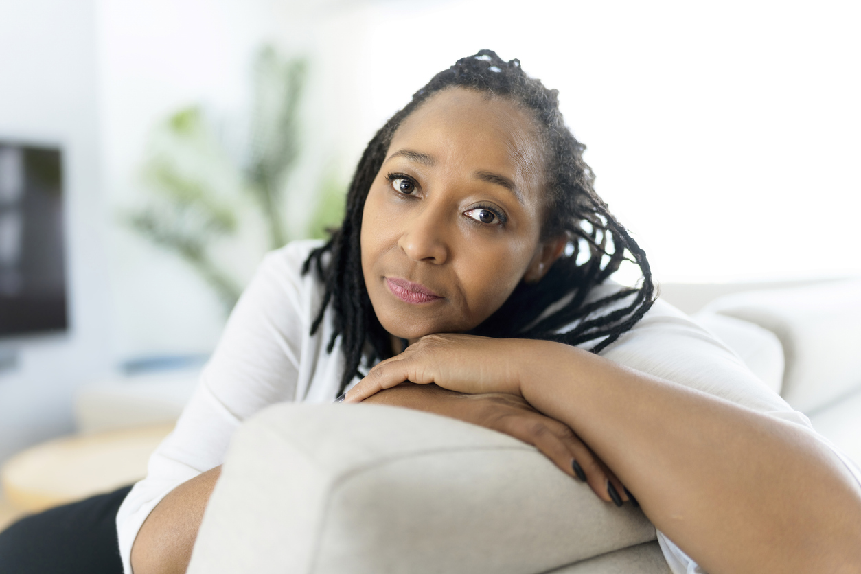 A Portrait of an african woman sit on the sofa